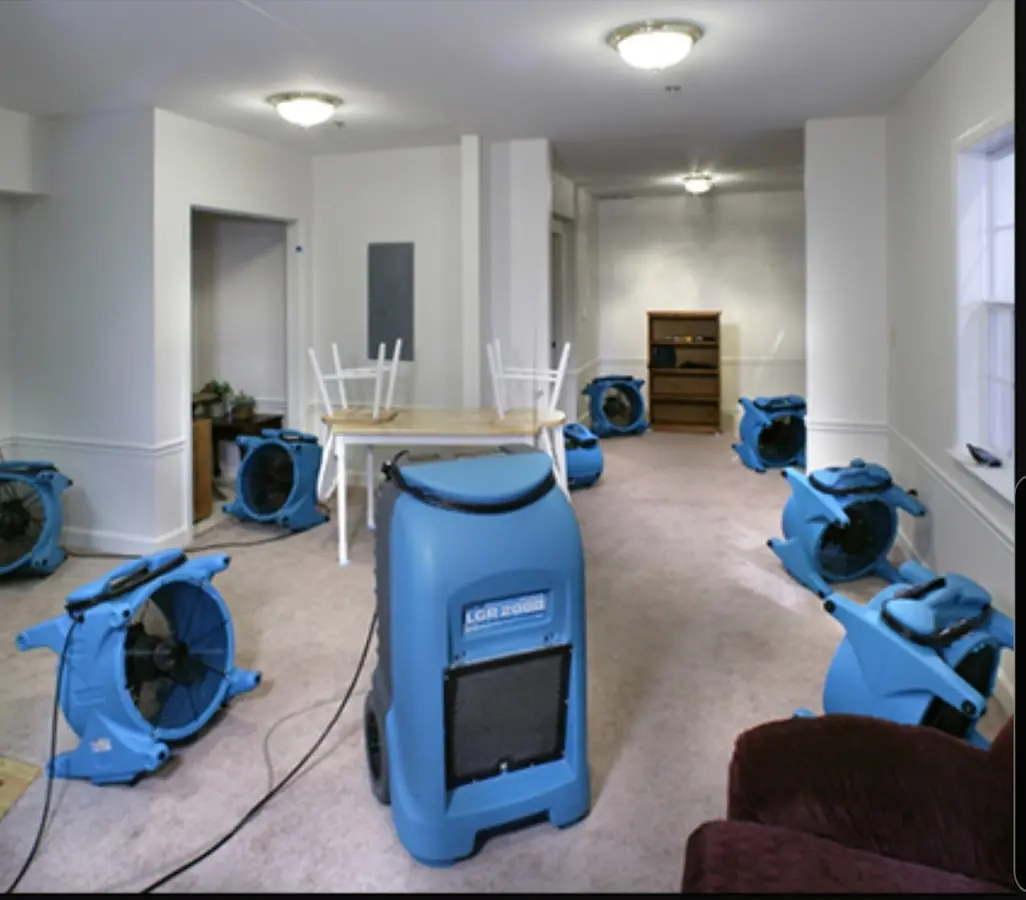 Air movers and dehumidifier setup for Water Damage Restoration in New Gloucester
